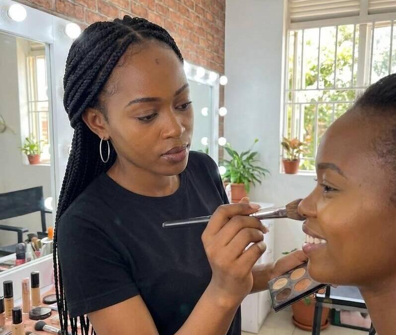 Image of a makeup artist serving a client